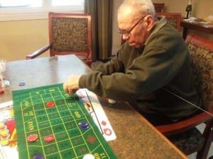 Resident at Dolan playing a game Resident at Dolan playing a game